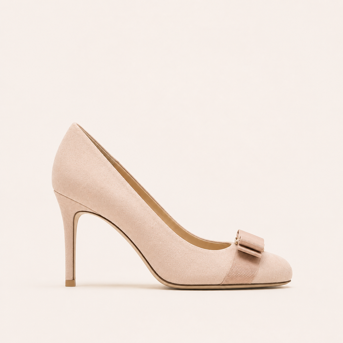 Faux suede bow pumps with round toe design