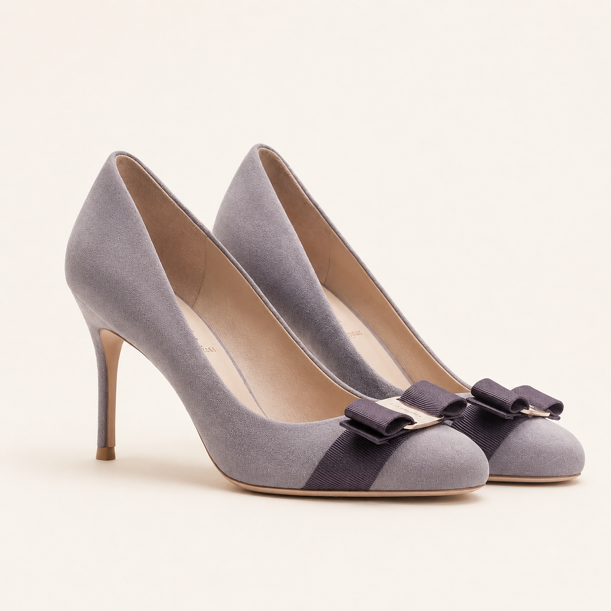 Faux suede bow pumps with round toe design