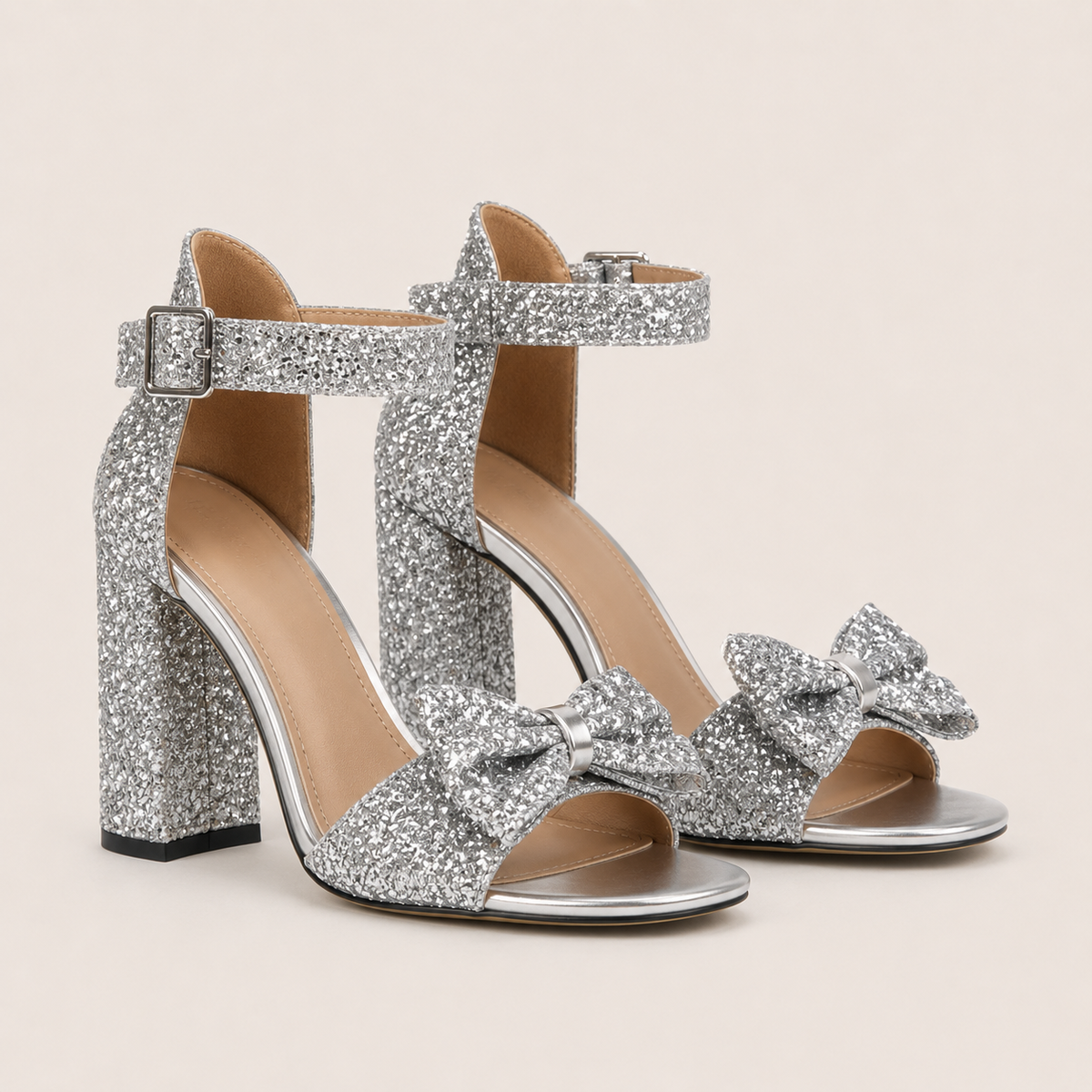 Silver patent high heel mules with decorative bow
