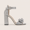 Silver patent high heel mules with decorative bow