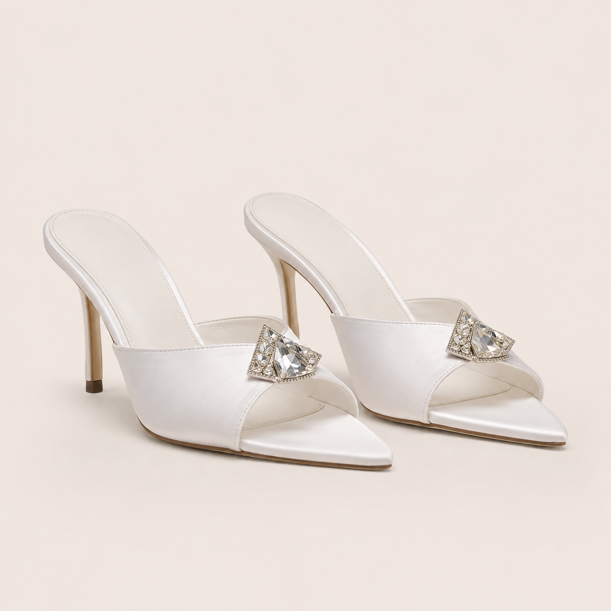 White satin sandals with rhinestone accents and stiletto heel