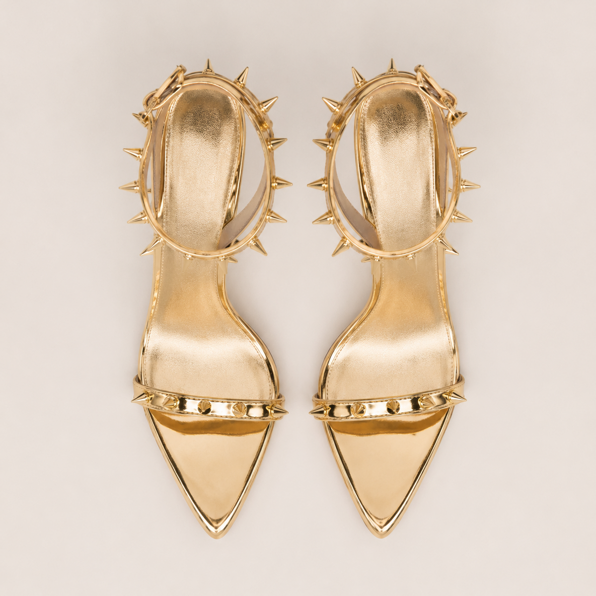 Gold pointed-toe high heel sandals with rivet buckle detail